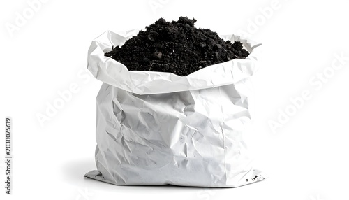 A white bag filled with black coffee grounds on a plate