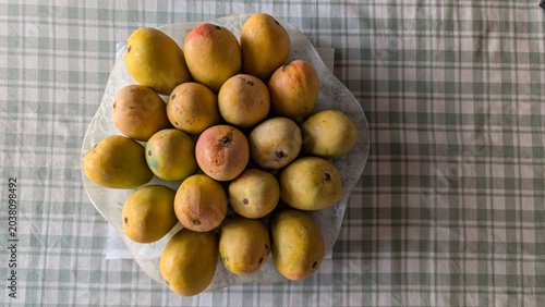 Photography Fresh, Juicy and Ripe organic mangoes, King of fruits in south asia, kept in a f