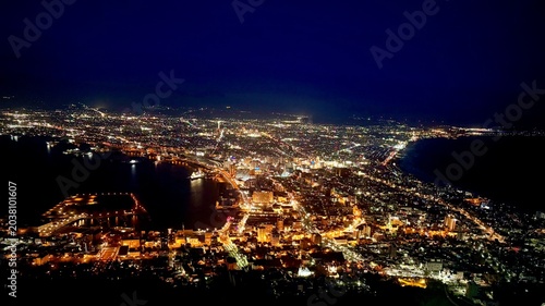 High angle view of Hakodate beautiful bay nightscape with glittering city lights in spring.