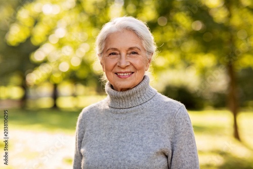 Elderly woman smiling outdoors
