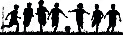 Obraz na płótnie Children playing soccer on grass field
