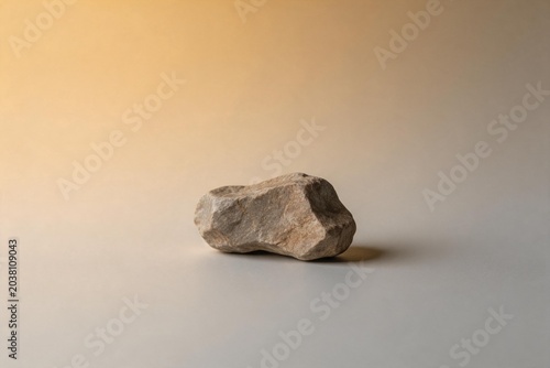 Singular rock on gradient background