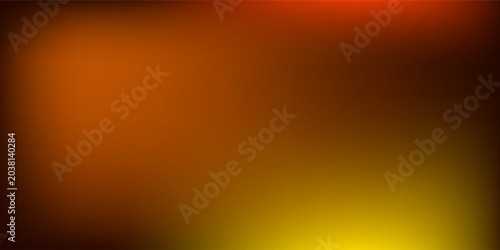 A close-up view of ribbed glass illuminated by a warm glowing light that transitions from deep orange to bright yellow creating a textured modern