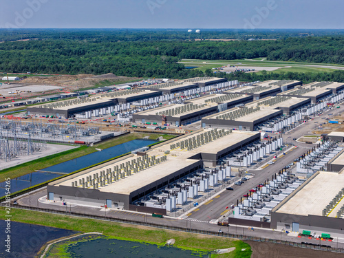 Aerial view of the construction of data center complex, large AI center structure surrounded by cooling and power systems