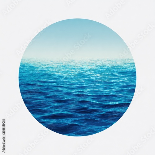 Blue ocean and sky landscape within a white circle