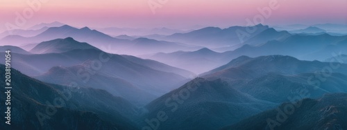 Misty mountain range at dawn