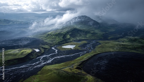 Aerial view of Icelandic volcanic landscape. Lush green valleys and dark lava flows