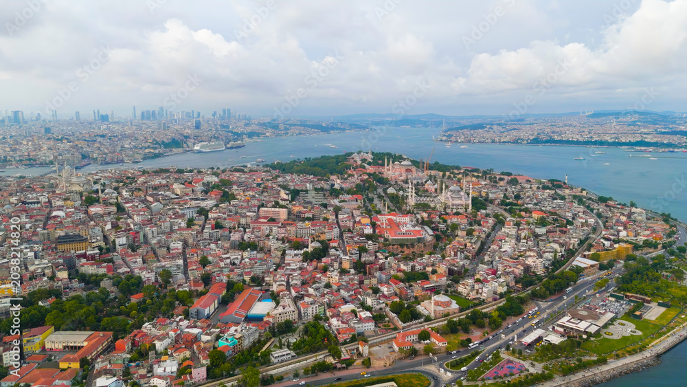 Obraz premium Istanbul, Turkey. Bosphorus embankment. Historical city center. Fatih district. Cloudy weather at sunset, Aerial View