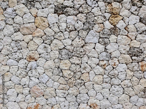 Bild auf Leinwand Background with textured stone wall patterns in neutral tones