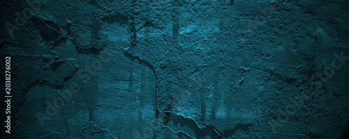 Cuadro en lienzo Deep blue rough textured stone wall is ideal for backgrounds with a shadowy, moody vibe