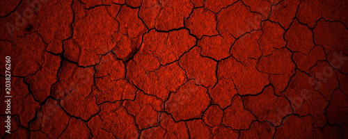 Принти на полотні Rough, dry red earth texture, cracked patterns in a desert landscape