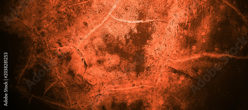 Foto Bright orange textured surface with gritty, rough, cracked, and weathered lines, suitable for backgrounds, textures, or abstract design projects