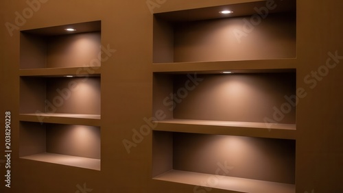 Empty brown recessed wall shelves with warm spotlighting create a modern minimalist Wallpaper Background image