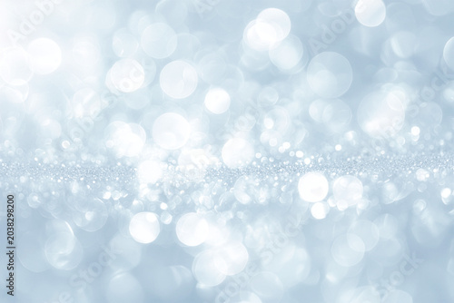 Soft blue sparkling bokeh background with airy light