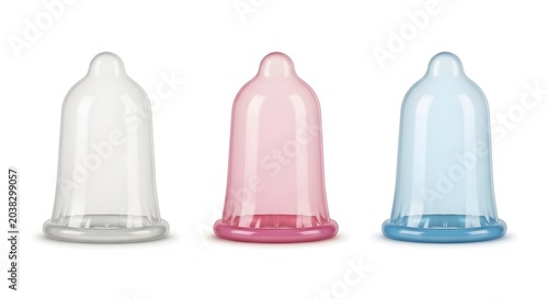 Latex condoms in three colors, pink and blue rubber contraceptives