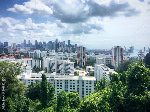 фотографія Singapore cityscape with residential buildings, port and lush greenery, February