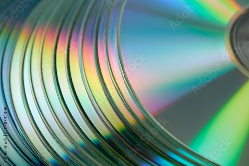 Photos A close-up of many laser CD discs shimmering with rainbow colors.