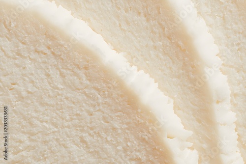 Close-up view of fluffy, white cake layers, showcasing their soft texture and delicate crumb