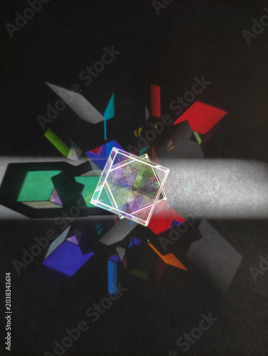 prism,colorful light,Diamond Reflections	,Optical Glass Prism with Light Refraction and Color Dispersion Projecting Vibrant Rainbow Spectrum Light Beams on Dark Black Background