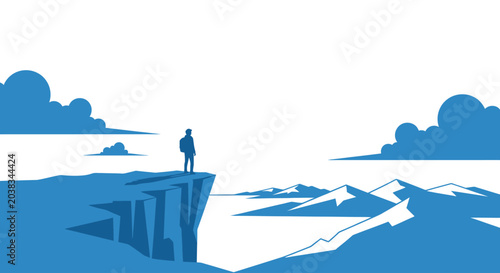 Photos Man standing on mountain cliff edge.