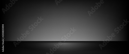 Fotografía Black empty limbo background with grey wall and stone floor for podium