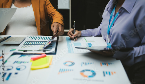 Auditor and accountant team working in office, analyze financial data and accounting record with calculator. Accounting company provide finance and taxation planning for profitable cash flow. Insight