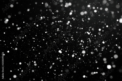 A mesmerizing blur of white particles against a dark backdrop.