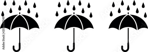 Fotografie Black silhouette umbrella vector icons set with falling rain drops isolated on a
