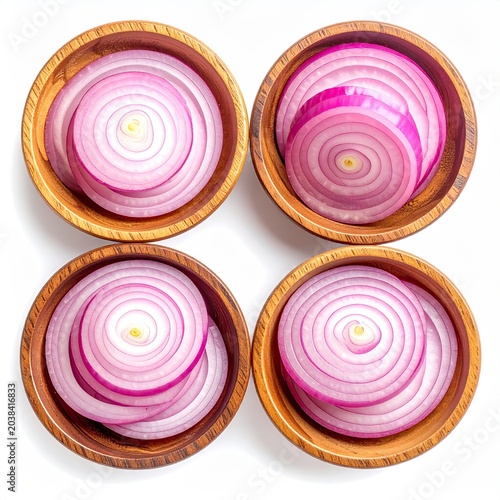 Four wooden bowls, each holding sliced red onions