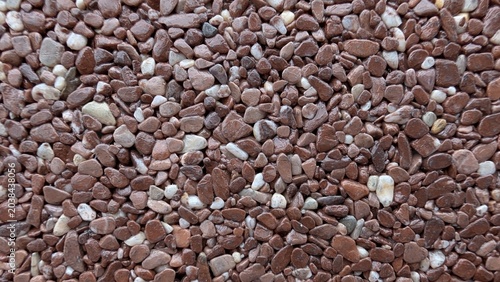 Foto Intricate Pattern Combining Pebbles And Shell Fragments Suitable For Creative An