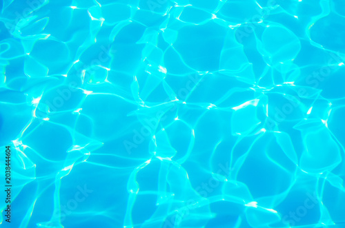water in swimming pool rippled water detail background