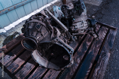 manual transmission from an old front-wheel drive car removed for cleaning and washing, repair and replacement of oil seals