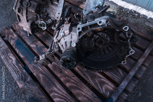 manual transmission from an old front-wheel drive car removed for cleaning and washing, repair and replacement of oil seals