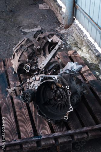 manual transmission from an old front-wheel drive car removed for cleaning and washing, repair and replacement of oil seals