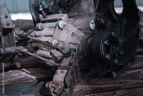 manual transmission from an old front-wheel drive car removed for cleaning and washing, repair and replacement of oil seals