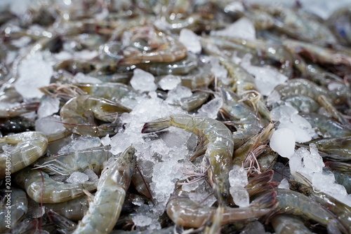 High angle view of raw and fresh Shrimp  displayed on ice tray in a traditional wet market in Thailand.