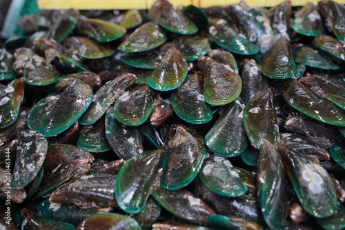 High angle view of raw and fresh Shrimp  displayed on ice tray in a traditional wet market in Thailand.