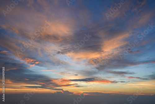 sunrise with mountain, trees, hills, shadows and morning fog