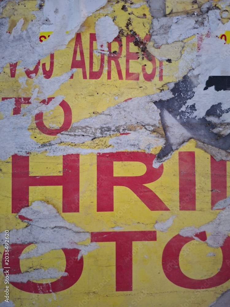 Fototapeta premium Torn and ripped street poster, grungy background, messy old paper collage