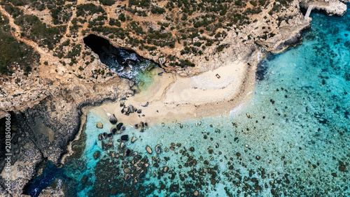 Obraz na plátně Landscape aerial drone shot Birds Eye view over the blue lagoon coast, malta wit