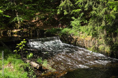 A cascade of the Schwarze Pockau river in the Schwarzwasser Valley, in Pockau, Ore Mountains, Saxony – Germany.