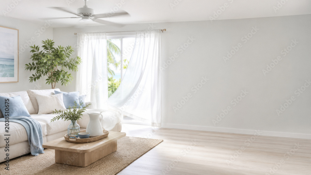 Fototapeta premium Coastal living room with ceiling fan and ocean view for vacation rental listing