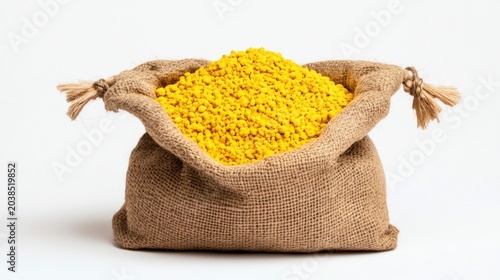 A jute sack filled with small, bright yellow granules.