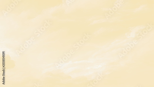 Soft white clouds in a pale yellow sky on a sunny day with a serene atmosphere and plenty of copy space