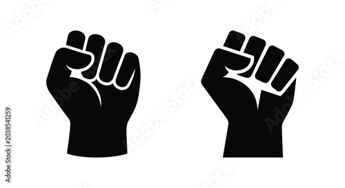Obraz na płótnie raised fists in silhouette black white background icon symbol power strength pro