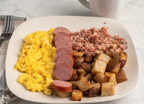 scramble eggs  with sliced kielbasa and  corn beef hash