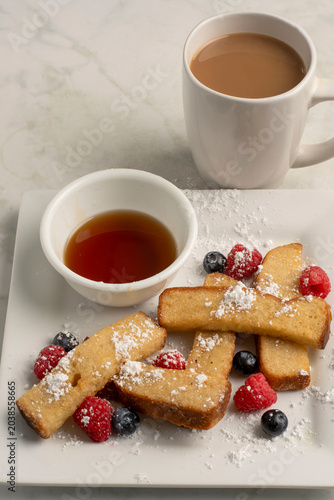 french toast sticks  with berries and coffee