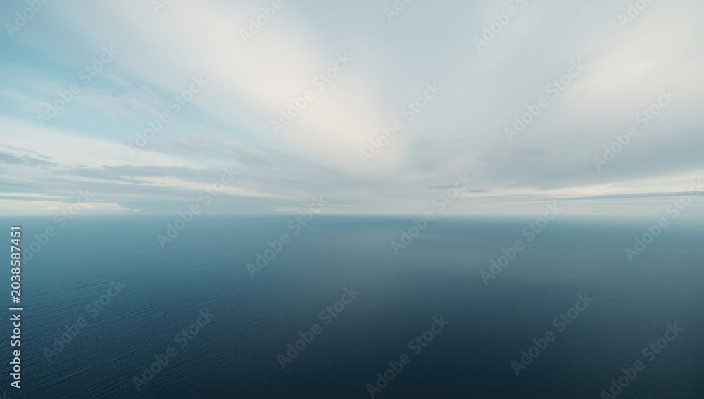 Fototapeta premium Grand still ocean panorama with gentle sky above
