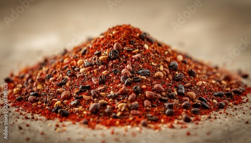 Eye-catching cayenne and mixed peppercorn heap emphasizing diverse cooking spice textures