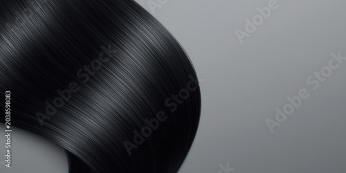 Glossy black hair strands detailed texture against soft gray backdrop for haircare styling